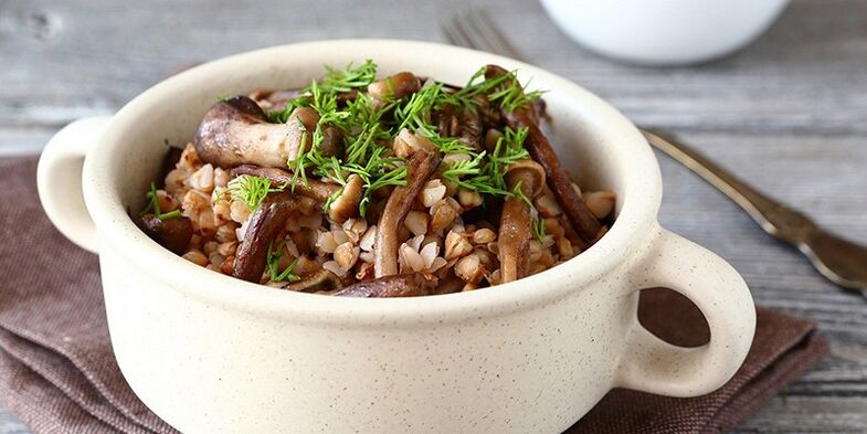 Buckwheat porridge with mushrooms for lunch in a healthy food menu